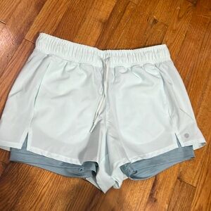 Women’s blue running shorts with spandex size medium